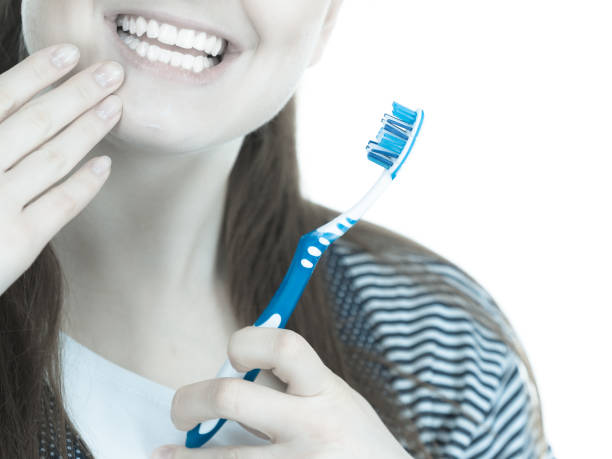 istock Woman brushing cleaning teeth. 1207734020