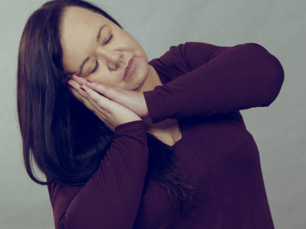 istock Woman being sleepy gesturing 1207734313