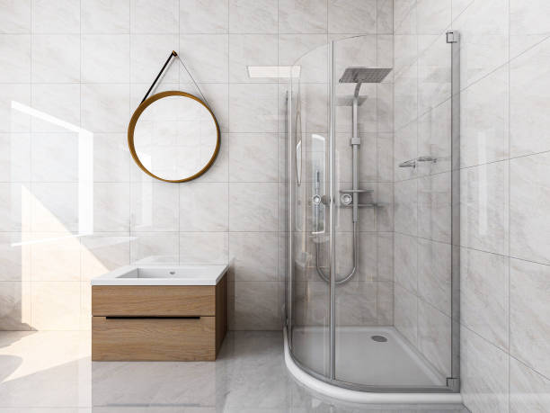istock 3D rendering, modern residential clean bathroom design, with washbasins, mirrors, toilets, shower equipment and bathtubs, the sun shines in from the floor window. 1207735477