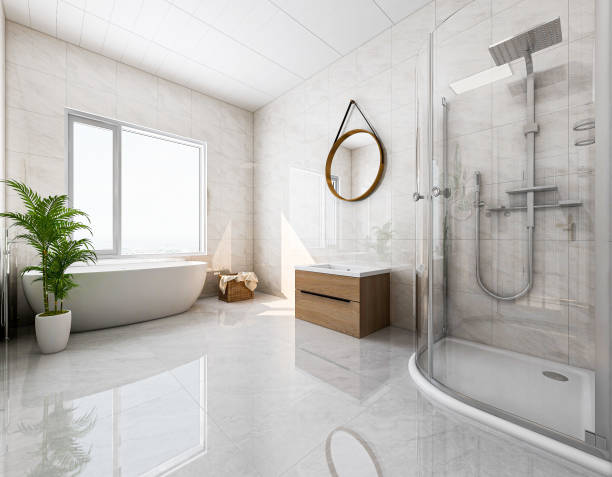 istock 3D rendering, modern residential clean bathroom design, with washbasins, mirrors, toilets, shower equipment and bathtubs, the sun shines in from the floor window. 1207735483