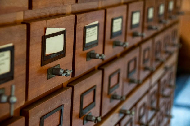 istock Old-fashioned library catalog with wooden drawers 1207737702