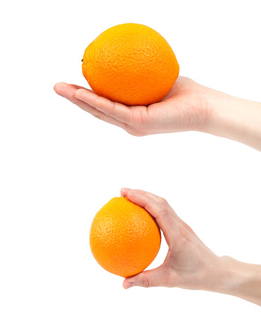 Hand holding organic delicious orange Isolated on white Background. Healthy eating and dieting concept