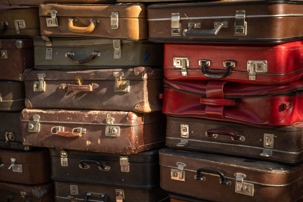 istock Aged weathered leather suitcases on top of eachother 1207740076