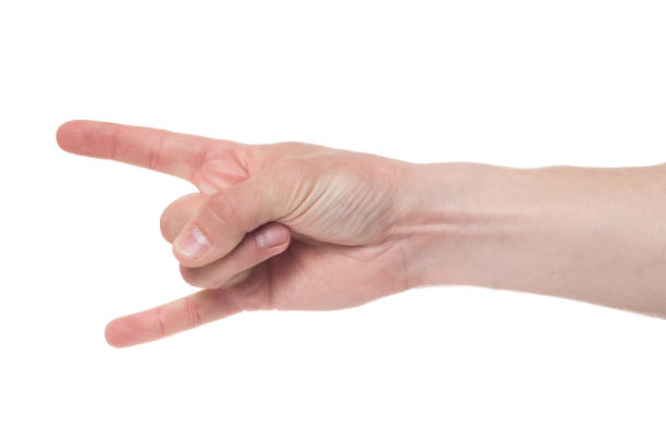 istock Hand shows the rock and roll sign isolated on a white background. 1207743758