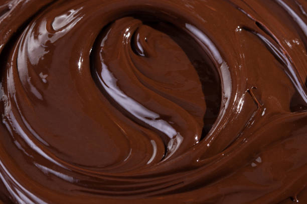 istock Chocolate texture. Liquid chocolate close-up.Textured dark chocolate 1207744999