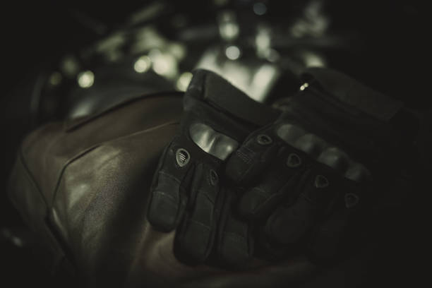 istock Vintage style motorcycle helmets and riding suits 1207745161