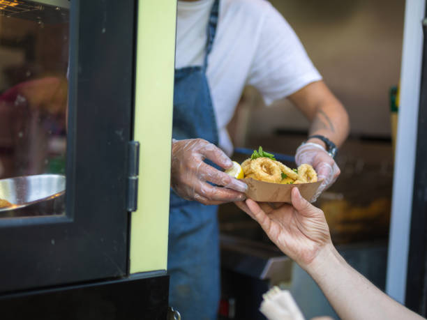 istock Street Food: Fried Fish, Squids Served in a Small Paperboard. 1207745334