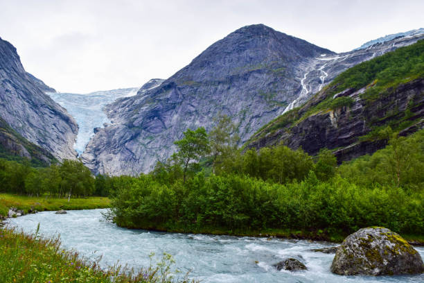 istock Waterfall and river from Briksdalsbreen (Briksdal) glacier. Jostedalsbreen National Park. Norway. 1207748423