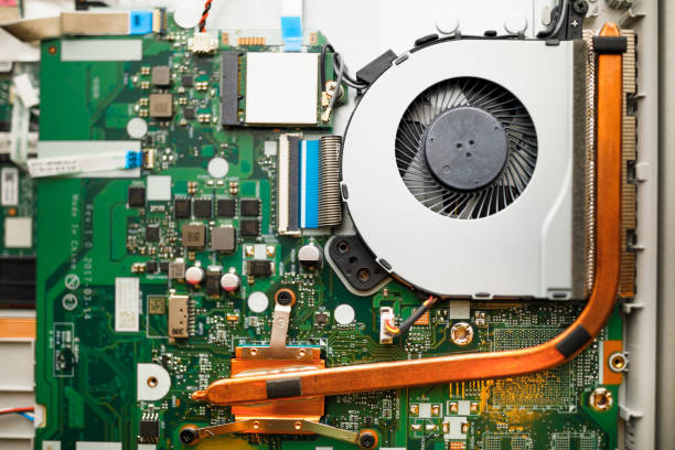 Computer motherboard and processor. The fan for cooling the microprocessor is installed. View from above.