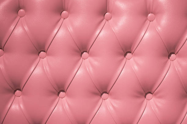 istock Coach-type velours screed tightened with buttons. Chesterfield style quilted upholstery backdrop close up. 1207750327