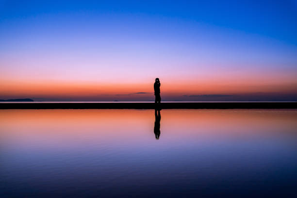 istock japan kagawa ocean person silhouette 1207753074
