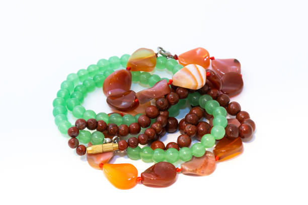 istock Jasper, agate and nephritis beads isolated on white background 1207758347