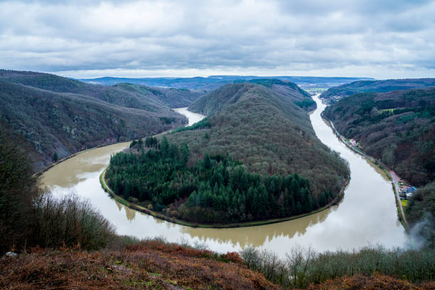 istock Germany, Mettlach, Slow moving clouds above world famous german river saar loop called saarschleife 1207759081