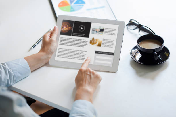 istock Sample online news website on tablet 1207760564