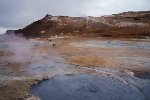 istock Braving the path across the bubbling volcanic muds, Iceland 1207761810