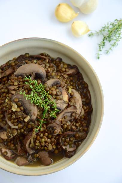 istock Delicious cooked rosemary garlic lentil with mushroom 1207764573