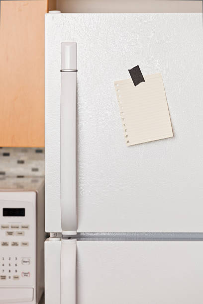 istock Blank note taped to white freezer door 120776710