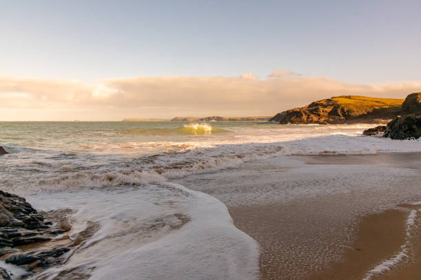The receding tide in the late afternoon glow, Cornwall, in winter