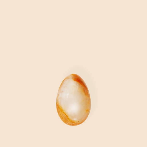 Easter egg made from Natural gemstone onyx. Trendy spring holiday greeting card. Monochrome Minimal flat lay background with copy cpase.