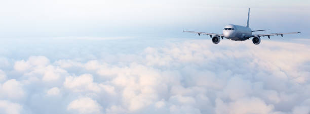 istock airplane fly  in the clouds 1207768737
