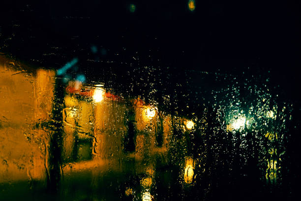 istock Rainy night with water droplets on glass 1207769786