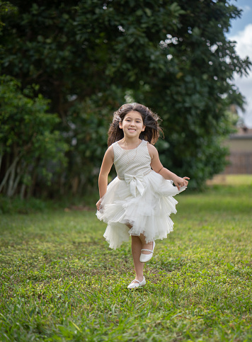 Six years old running on backyard