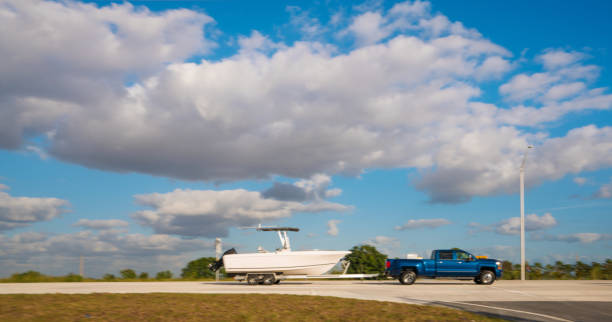 istock Pick up truck hauling small boat 1207781028