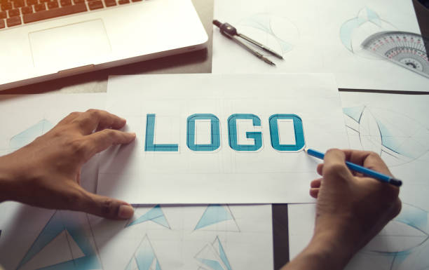 istock Graphic designer creative design sketch drawing logo Trademark brand Workspace 1207784571
