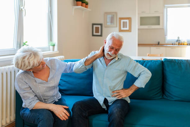 istock Senior lady comforting his husband with headache 1207784909
