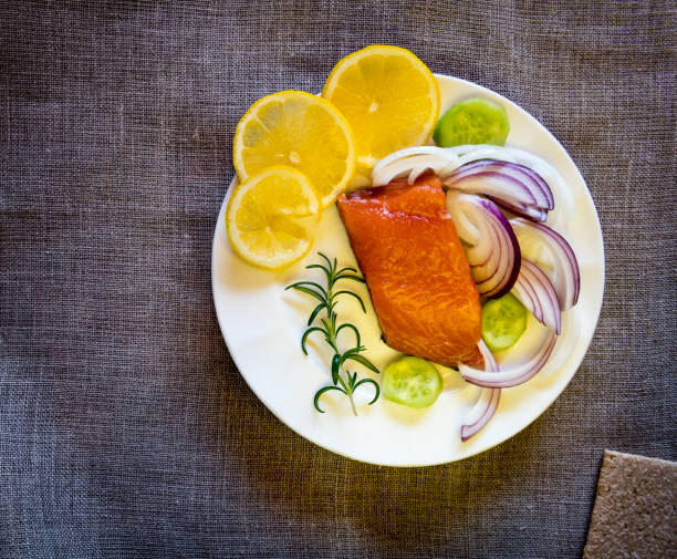 istock Smoked salmon or trout served with vegetables 1207793642
