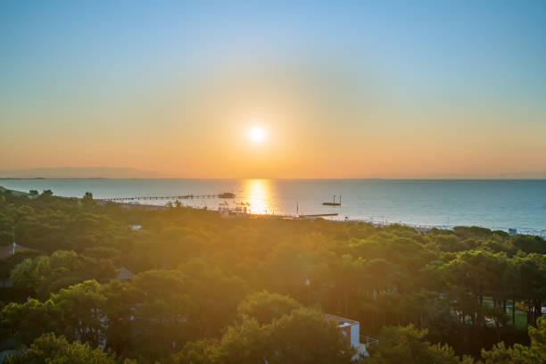 istock sun rises over sea horizon view from above 1207798132