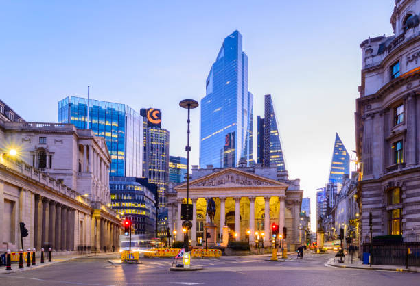 Illuminated City Skyscrapers on the Skyline London, UK - February 19, 2020: The Bank of England and the Royal Exchange in the City of London Financial District at Twilight, UK bank of england stock pictures, royalty-free photos & images