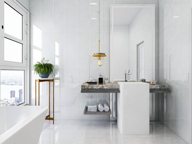 istock 3D rendering, modern residential clean bathroom design, with washbasins, mirrors, toilets, shower equipment and bathtubs, the sun shines in from the floor window. 1207800613