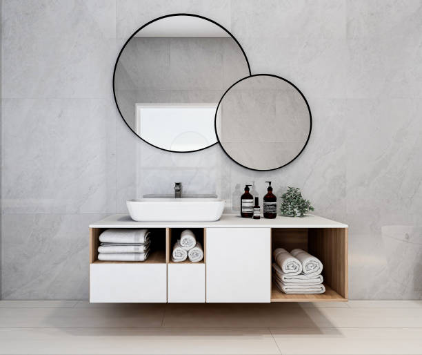 istock 3D rendering, modern residential clean bathroom design, with washbasins, mirrors, toilets, shower equipment and bathtubs, the sun shines in from the floor window. 1207800651