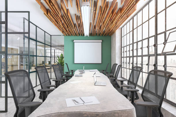 istock Modern conference room interior with projector screen on the wall for copy space 1207801316