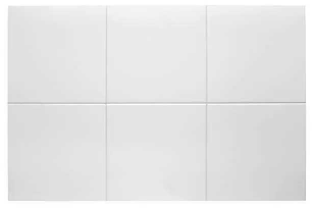 Photo of Close up of six white bathroom tiles