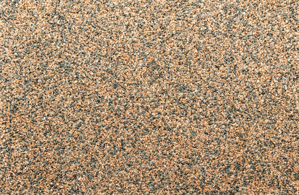 istock Decorative pebbles. Background and texture of brown and black pebbles. 1207807308