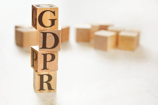 istock Four wooden cubes arranged in stack with letters GDPR meaning General Data Protection Regulation on them, space for text image at down right corner 1207808915