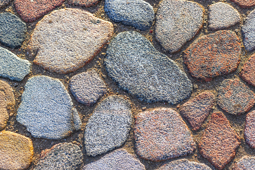 Colorful beautifully folded pavers. Different forms multi colored stones.
