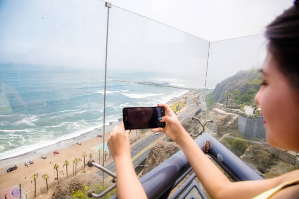 istock Young woman looking at the beach in Lima, Peru 1207813154