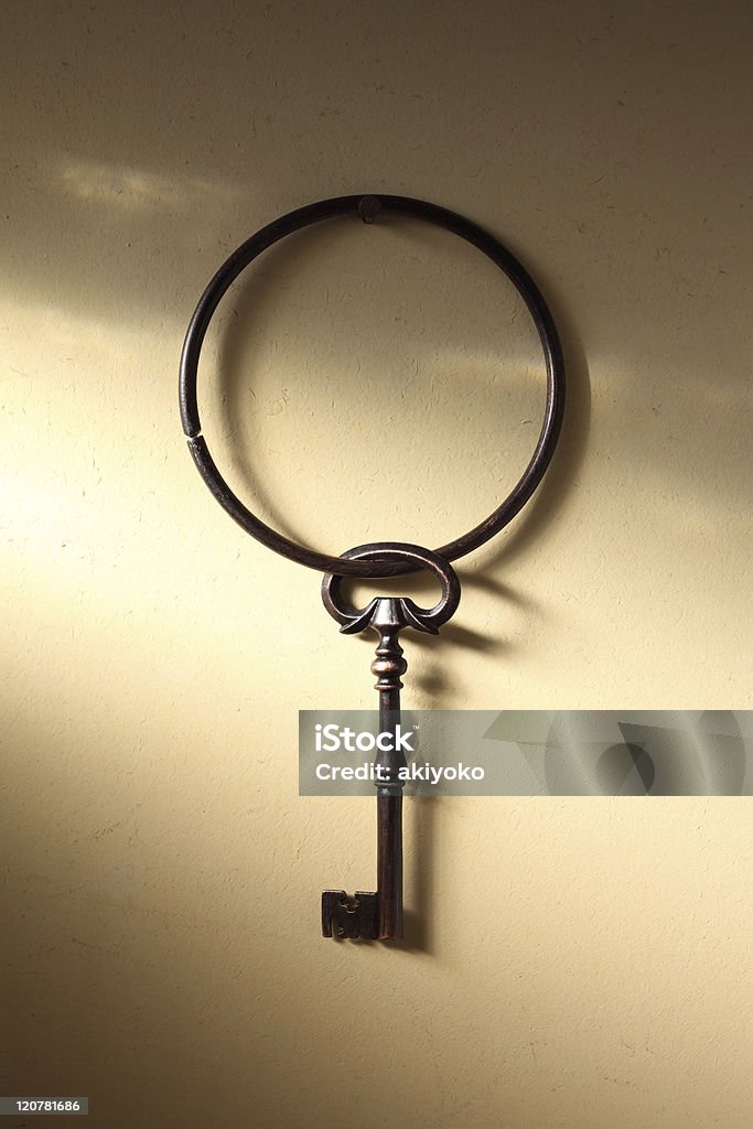 Old key hanging on a wall Ring of old key hanging on a wall Key Stock Photo