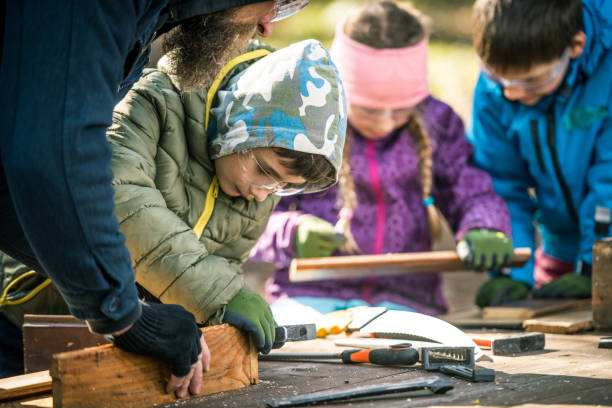 istock Young children doing crafts with their teacher 1207817115