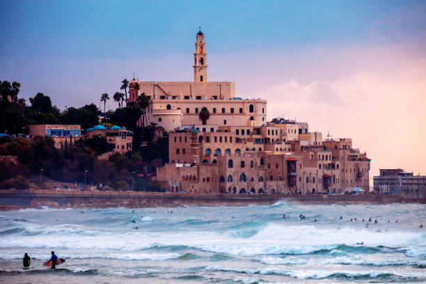 istock Jaffa sunset, surfers in action - Tel Aviv, Israel 1207819461