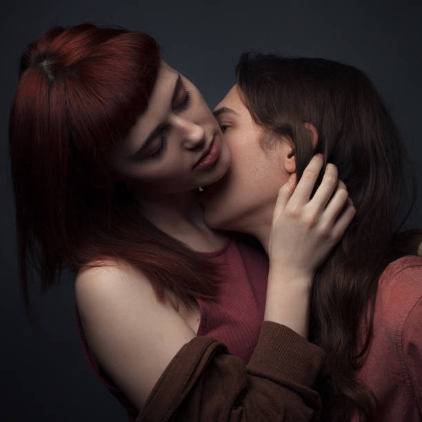 istock Young couple in love posing in studio 1207821472