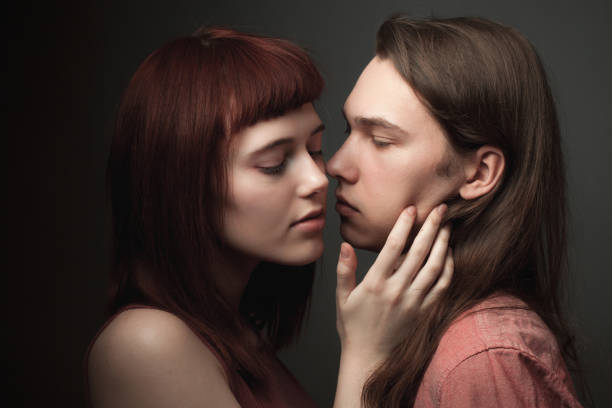 istock Young couple in love posing in studio 1207822923