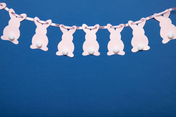 easter bunny. decoration on a blue background. easter garland. place for text. - easter remote blue cute imagens e fotografias de stock