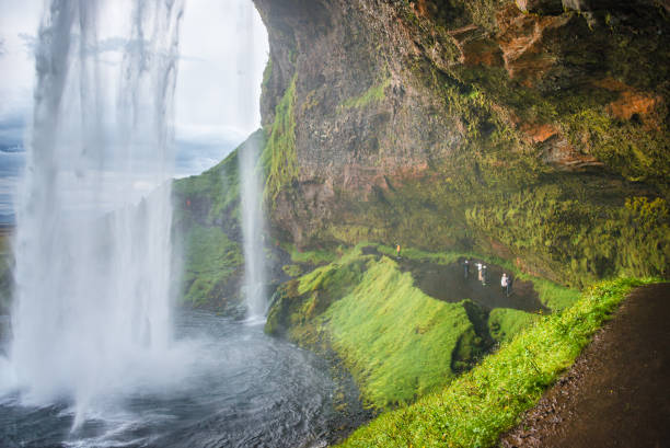 istock Beautiful, with cave inside Seljalandsfoss waterfall in South Iceland, summer time 1207824481