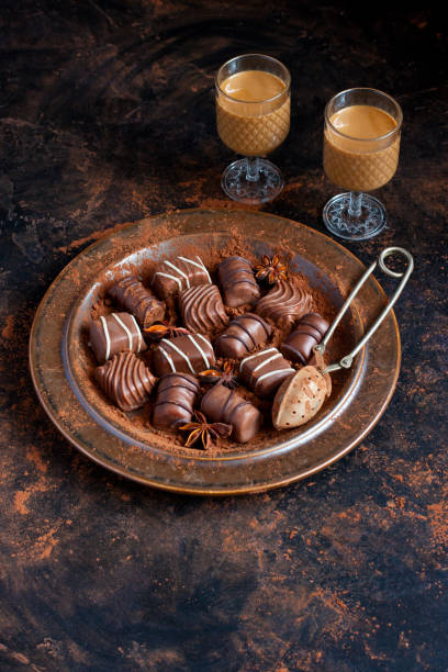 istock Sweet chocolate candy with liqueur in shot glass, dessert table 1207826020