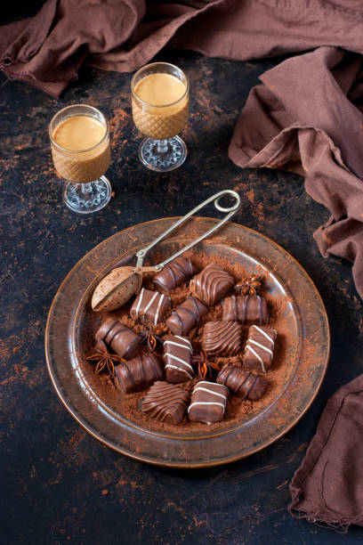 istock Sweet chocolate candy with liqueur in shot glass, dessert table 1207826027