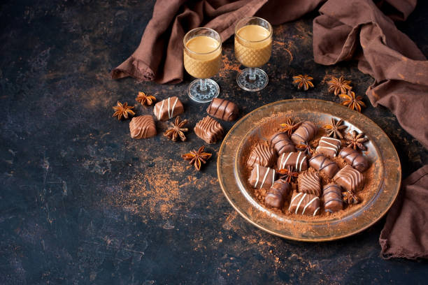 istock Sweet chocolate candy with liqueur in shot glass, dessert table 1207826030